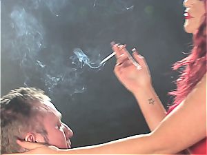 sandy-haired hoe predominates a man while smoking